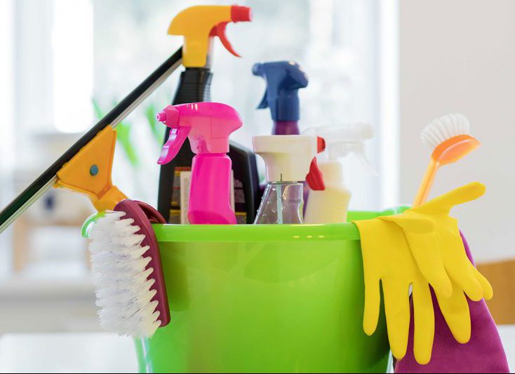 Green pail containing cleaning products